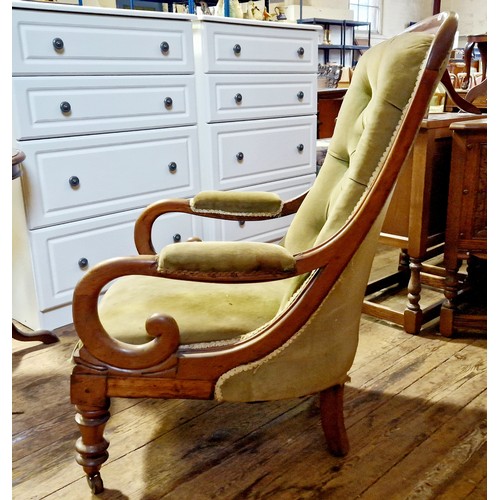 267 - Victorian mahogany framed velvet upholstered elbow chair on turned legs to castors