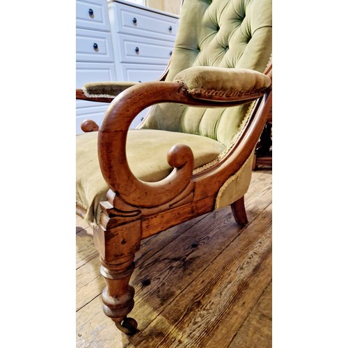 267 - Victorian mahogany framed velvet upholstered elbow chair on turned legs to castors