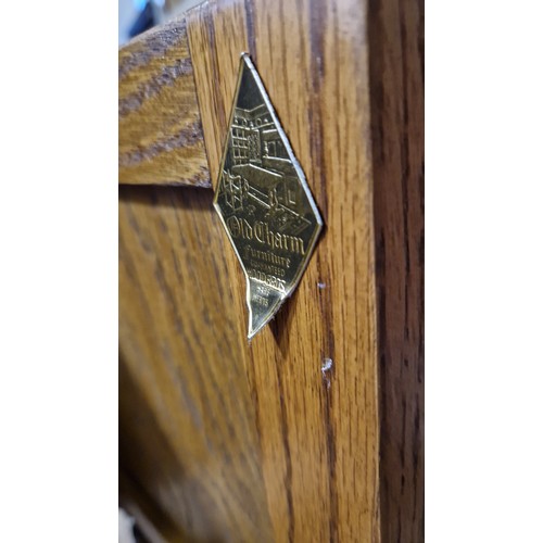 268 - Old Charm oak side cabinet with relief panels on turned legs