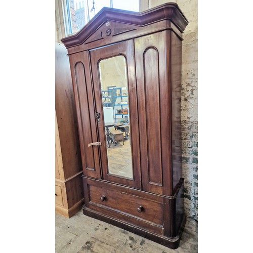 287 - Late Victorian mahogany wardrobe with mirrored door over single drawer