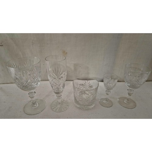 64 - Set of cut crystal tumblers and stemmed glasses