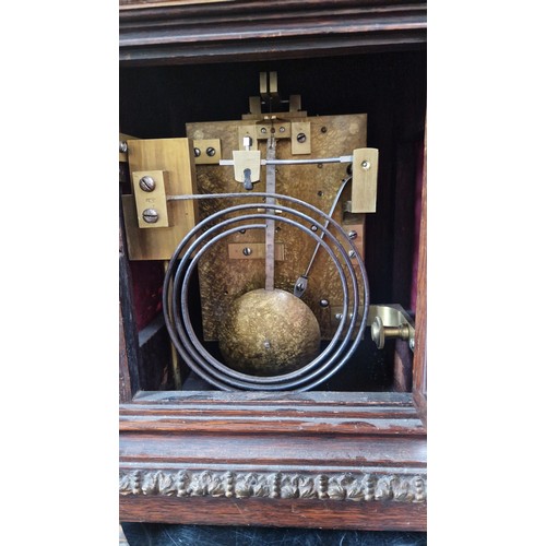 128 - Bracket clock by JW Benson of London 8692 with ormolu mounts, surmounted by a dog approx. 48cm tall,... 