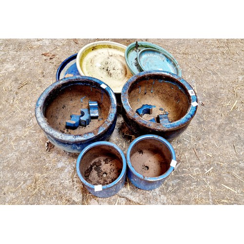 54 - Two blue glazed terracotta planters, feet and saucers