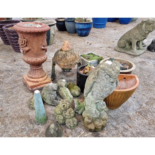 56 - Qty of simulated stone garden figures and planters, pot feet etc