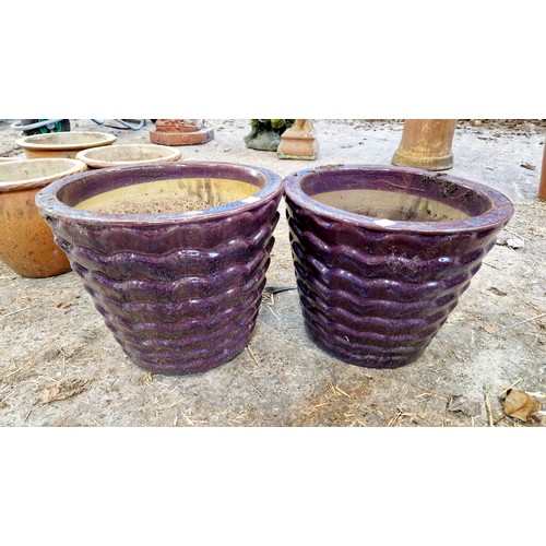 69 - Two pairs of coloured glazed terracotta planters