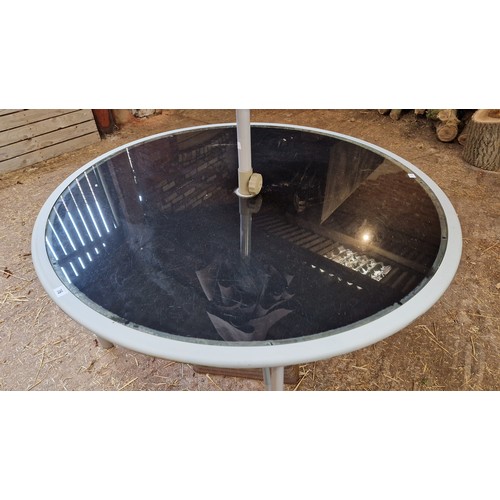 76 - Metal and glass circular garden table with parasol and base