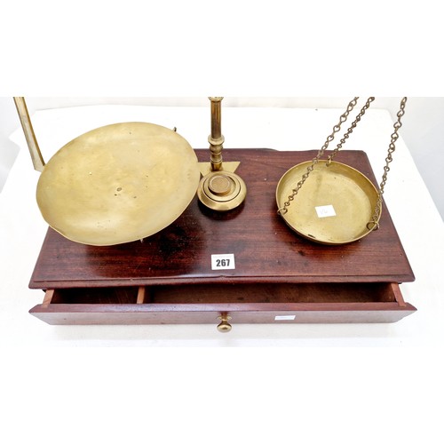 267 - Brass hanging scales on mahogany base with fitted drawer