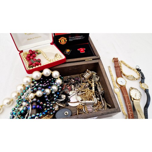 311 - A wooden box of various costume jewellery. ladies and gents wristwatches, Bolero pearls etc