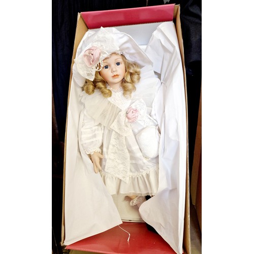 335 - Boxed Leonardo Elite girl porcelain doll