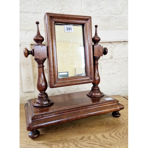 391 - Small rectangular mahogany framed toilet mirror with turned finials and supports