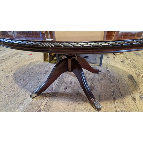 404 - Modern mahogany oval occasional table with gadrooned border on splayed feet