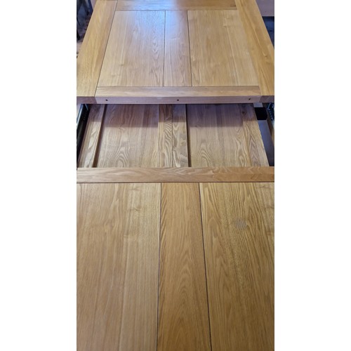 406 - Modern solid light oak dining suite comprising extending rectangular table and four upholstered chai... 