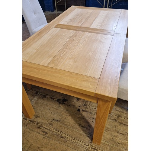 406 - Modern solid light oak dining suite comprising extending rectangular table and four upholstered chai... 