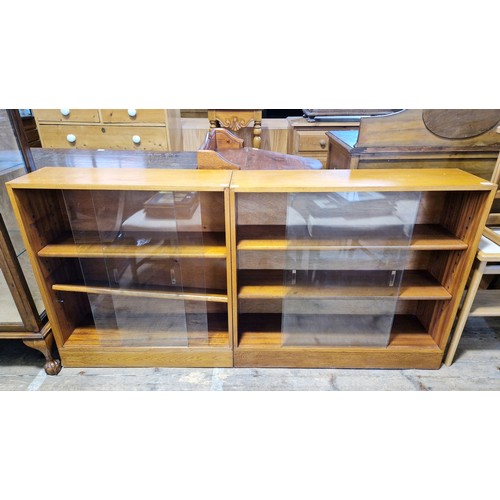 420 - Pair of vintage three-tier oak glazed book cases with sliding doors