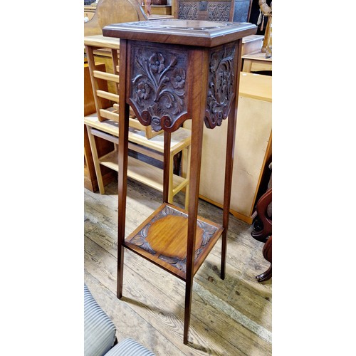 422 - Early 20th century mahogany two-tier jardinière stand with relief carved panels