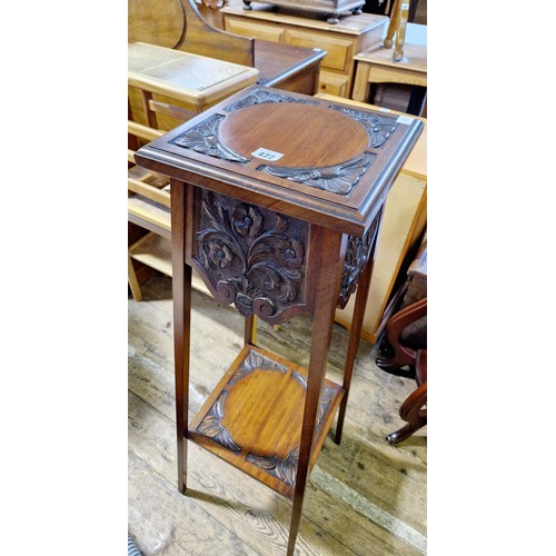 422 - Early 20th century mahogany two-tier jardinière stand with relief carved panels