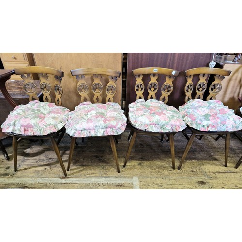 424 - Set of four vintage Ercol style fleur-de-lis wheelback kitchen chairs