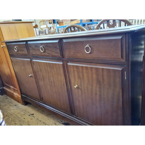 434 - Stag Minstrel sideboard with three drawers including cutlery over a cupboard base