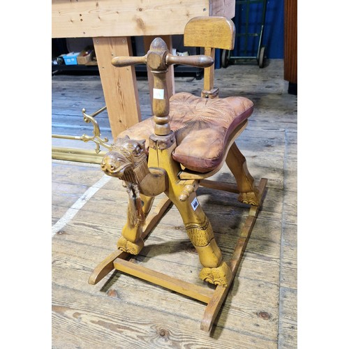 448 - Rocking camel stool with leather cushion and handles