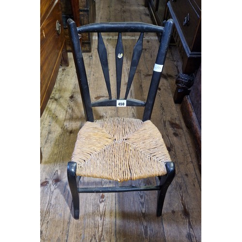 450 - Childs ebonised chair with rush seat