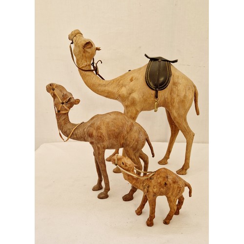 146 - Set of three hide camel figurines