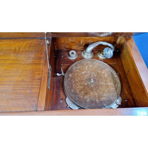 189C - Mid-century walnut cased gramophone in mirrored back cabinet on cabriole legs, includes gramophone h... 