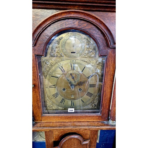 204 - Oak long cased clock with brass dial, 8-day movement by J Dorons Louth