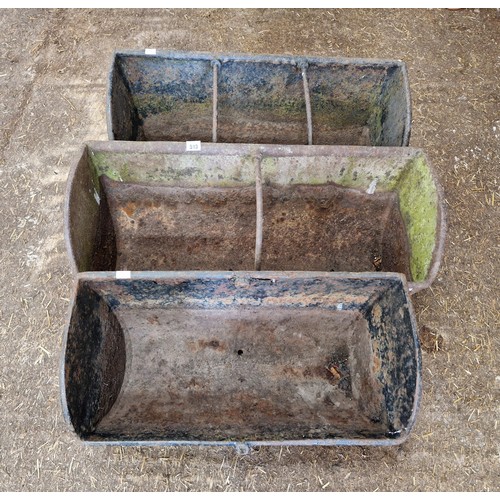 513 - Three cast iron feed troughs