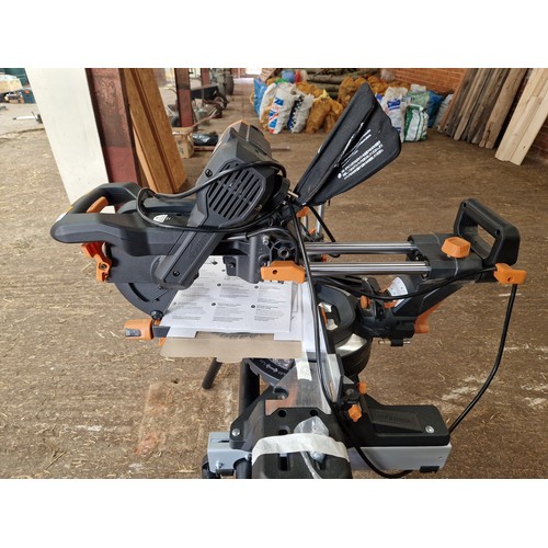 520 - Evolution R255 double bevel sliding mitre saw on stand with 2 used blades