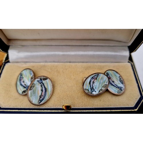 281 - A cased pair of Sheffield 1995 silver angling theme cuff links, with oval enamelled panels of leapin... 