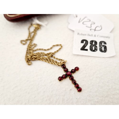 286 - Victorian gold crucifix on chain inset with garnets