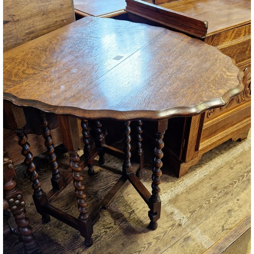 427 - Early 20th century small oval oak gate leg table with pie crust edge on barley twist legs