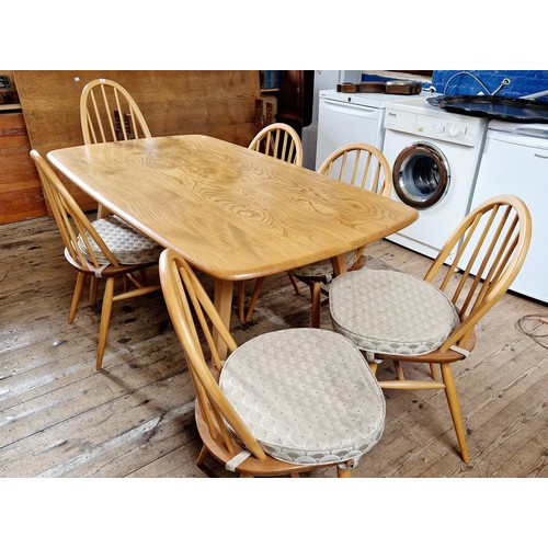 407 - Ercol Windsor dining suite comprising rectangular table, 6 spindle back chairs (5+1) and a single Qu... 