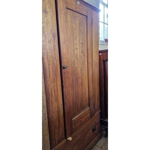 486 - Early 20th century oak wardrobe with single drawer to the base