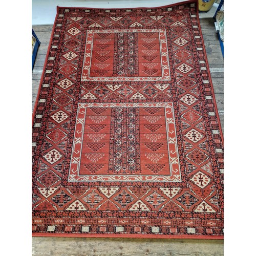 239 - Two modern woollen Afghan patterned rugs approx. 160 x 230cm and 194 x 137cm