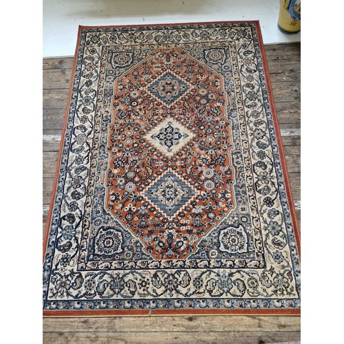 239 - Two modern woollen Afghan patterned rugs approx. 160 x 230cm and 194 x 137cm