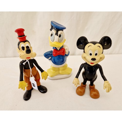 49 - Three Disney figurines comprising metamorphic Pluto and Micky plus Donald Duck