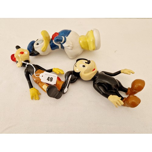 49 - Three Disney figurines comprising metamorphic Pluto and Micky plus Donald Duck