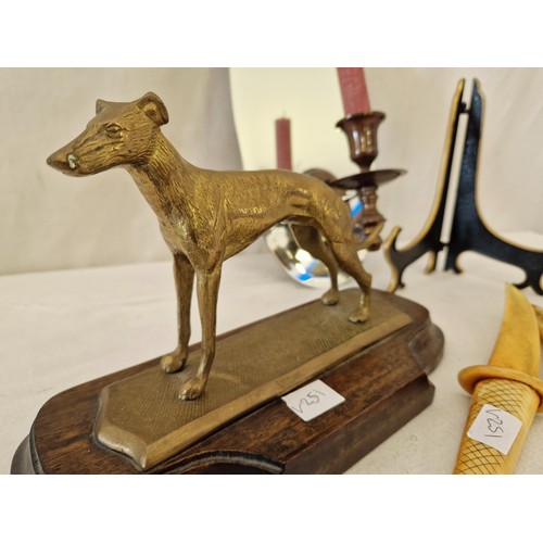 124 - Brass greyhound sculpture on wooden plinth, mirrored sconce etc