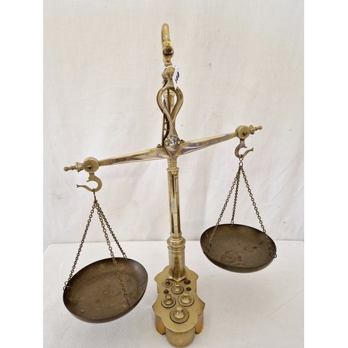 140 - Brass hanging scales with fitted weights