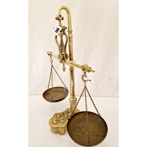 140 - Brass hanging scales with fitted weights