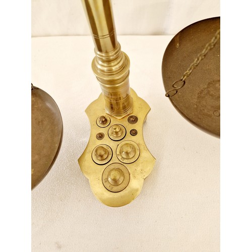 140 - Brass hanging scales with fitted weights