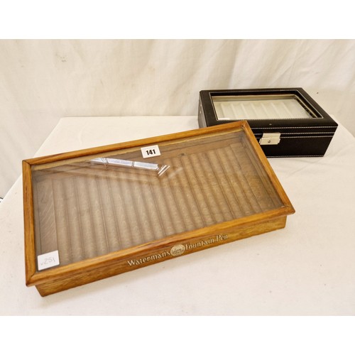 141 - Vintage Waterman's Ideal Fountain pen, glazed and wooden table top retail cabinet and a modern leath... 