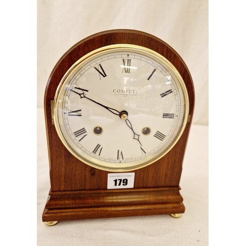 179 - Comitti London mahogany cased mantel clock on brass feet