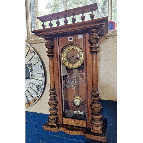 184 - Edwardian mahogany cased wall clock with spell band