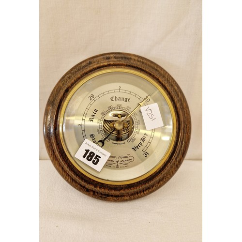 185 - Comitti London circular oak mounted aneroid barometer