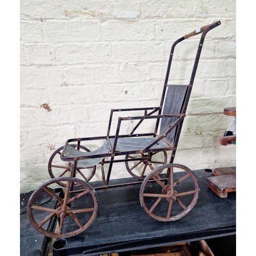 193 - Victorian dolls pushchair on iron spoked wheels