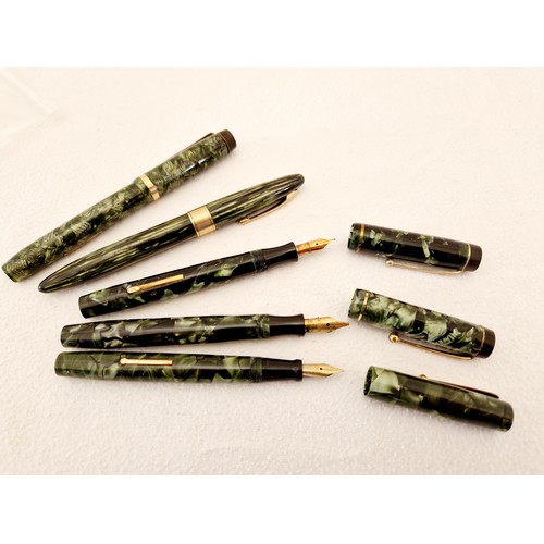 222 - A collection of five green mottle cased fountain pens, two Mentmore Auto-Flow, one lever fill; Valen... 