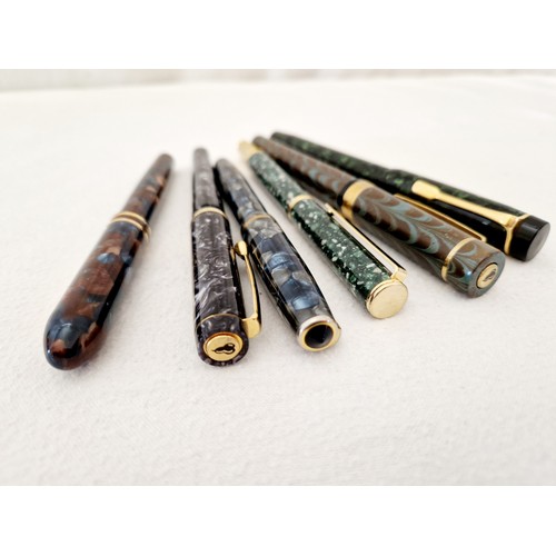 223 - A collection of six mottle cased fountain pens, Burnham B48; Conklin USA; three German with Iridium ... 