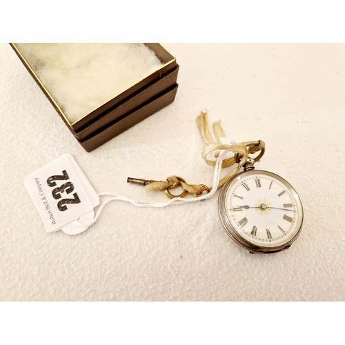 232 - A silver cased ladies fob watch with enamelled and gilt dial, with key